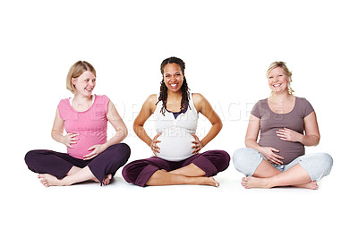 Buy stock photo Pregnant women or friends ready for yoga, pilates or birth class for help, support and community or wellness. Happy mother with smile and hope of life growth sitting on floor with white background