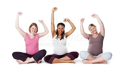 Buy stock photo Pregnant, happy, and healthy, women sitting on the floor, arms raised in celebration of new life. Mothers, friends, and happiness during pregnancy, a group of future moms workout on white background