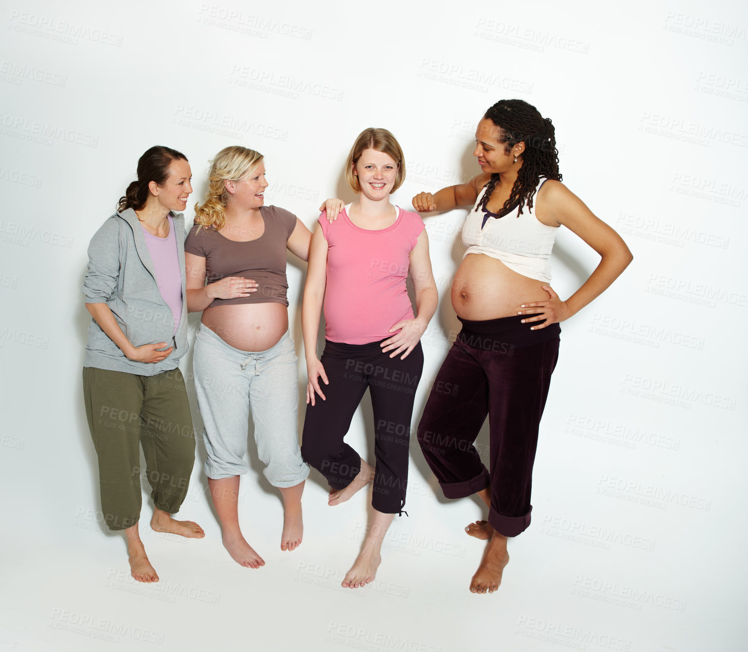 Buy stock photo Diversity, pregnant friends and mother in studio with support or trust in pilates, health and yoga clothes in studio. Smile, happy and wellness pregnancy lifestyle with positive women portrait