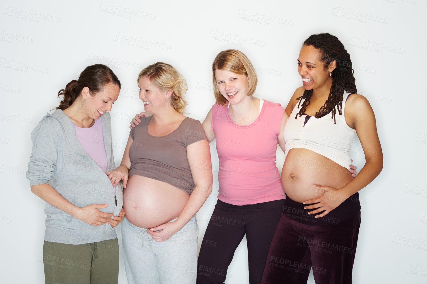 Buy stock photo Pregnant, health and wellness with a group of woman friends expecting a baby in studio against a white background. Mother, family and children with happy women with a smile and happy in pregnancy