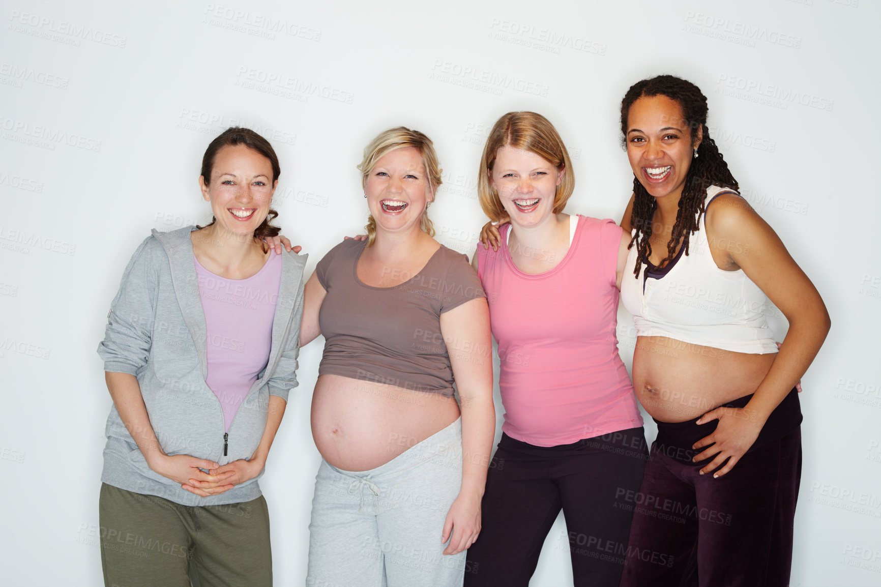 Buy stock photo Pregnant friends standing together while isolated on white