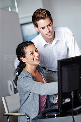 Buy stock photo Two young designers collaborating on a project together