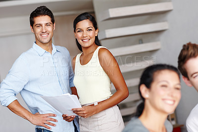 Buy stock photo Portrait of two creative directors smiling at you while discussing a project brief