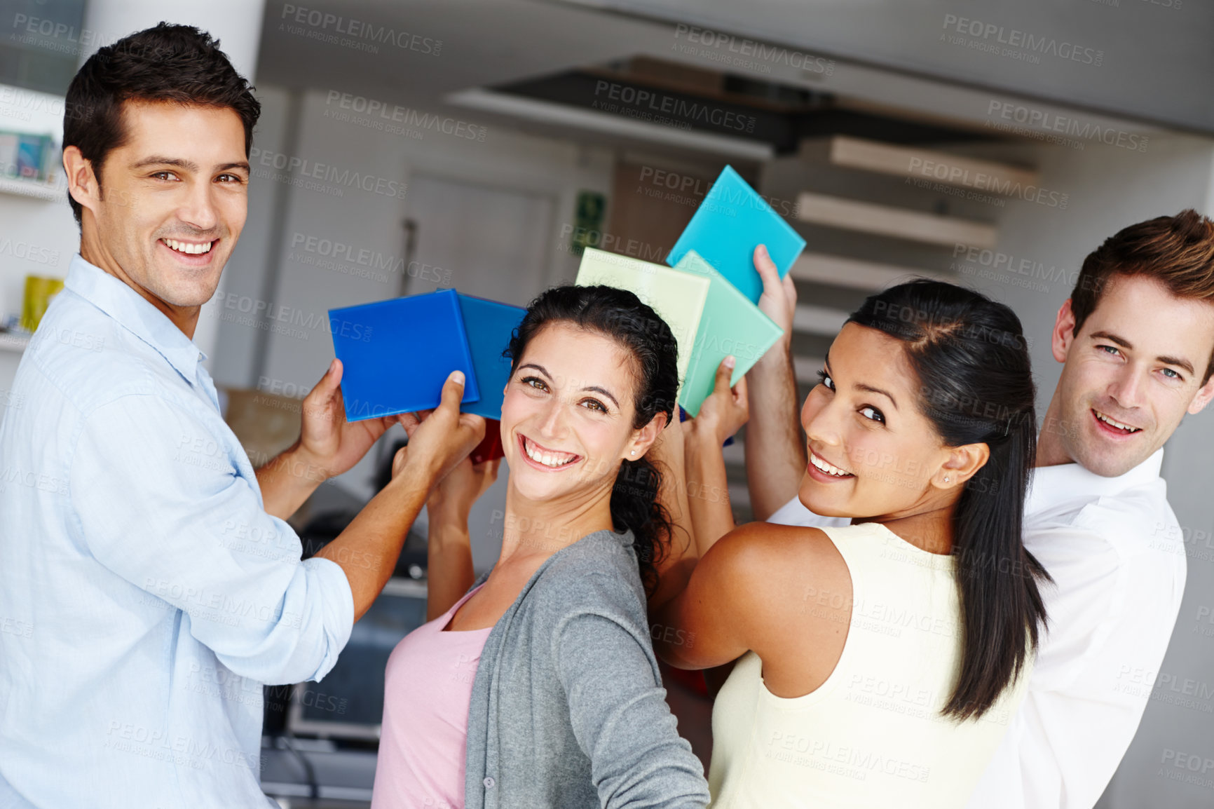 Buy stock photo A team of creative colleagues trying to decide on a colour scheme for a project