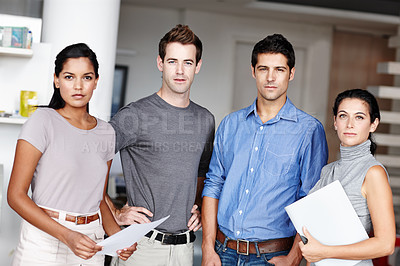 Buy stock photo A young team of business people looking at you confidently