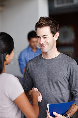 Buy stock photo A handsome young man meeting a colleague for the first time