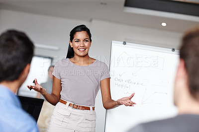 Buy stock photo A young businesswoman facilitating a budget meeting in the boardroom