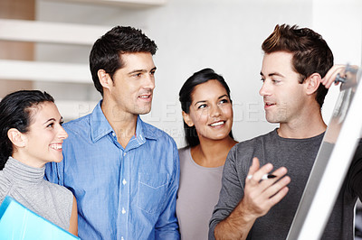 Buy stock photo A team of architects collaborating on a project together