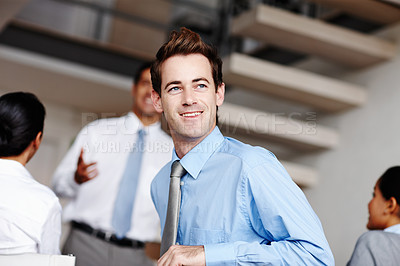 Buy stock photo An inspired businessman turning to look out of the window during a motivating business presentation