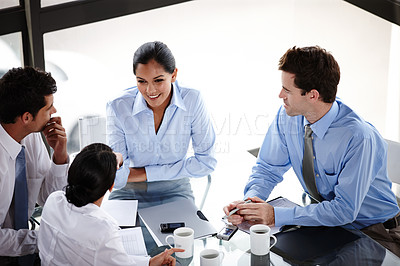 Buy stock photo A business team collaborating on a project in the boardroom