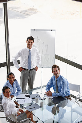 Buy stock photo Portrait of a group of successful businesspeople attending a presentation in the boardroom