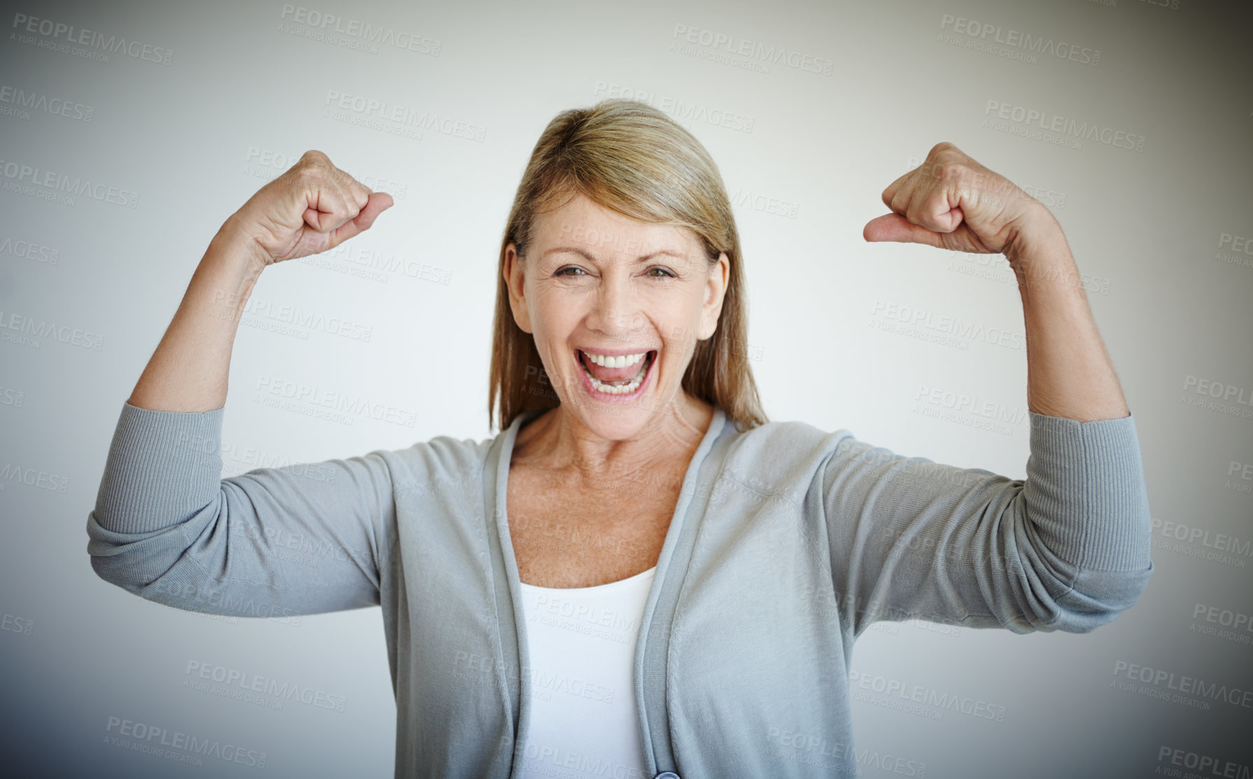 Buy stock photo Flexing, portrait and smile with mature woman in studio on gray background for achievement or victory. Arms, bicep and winner with strong person showing muscles for health goal, motivation or success