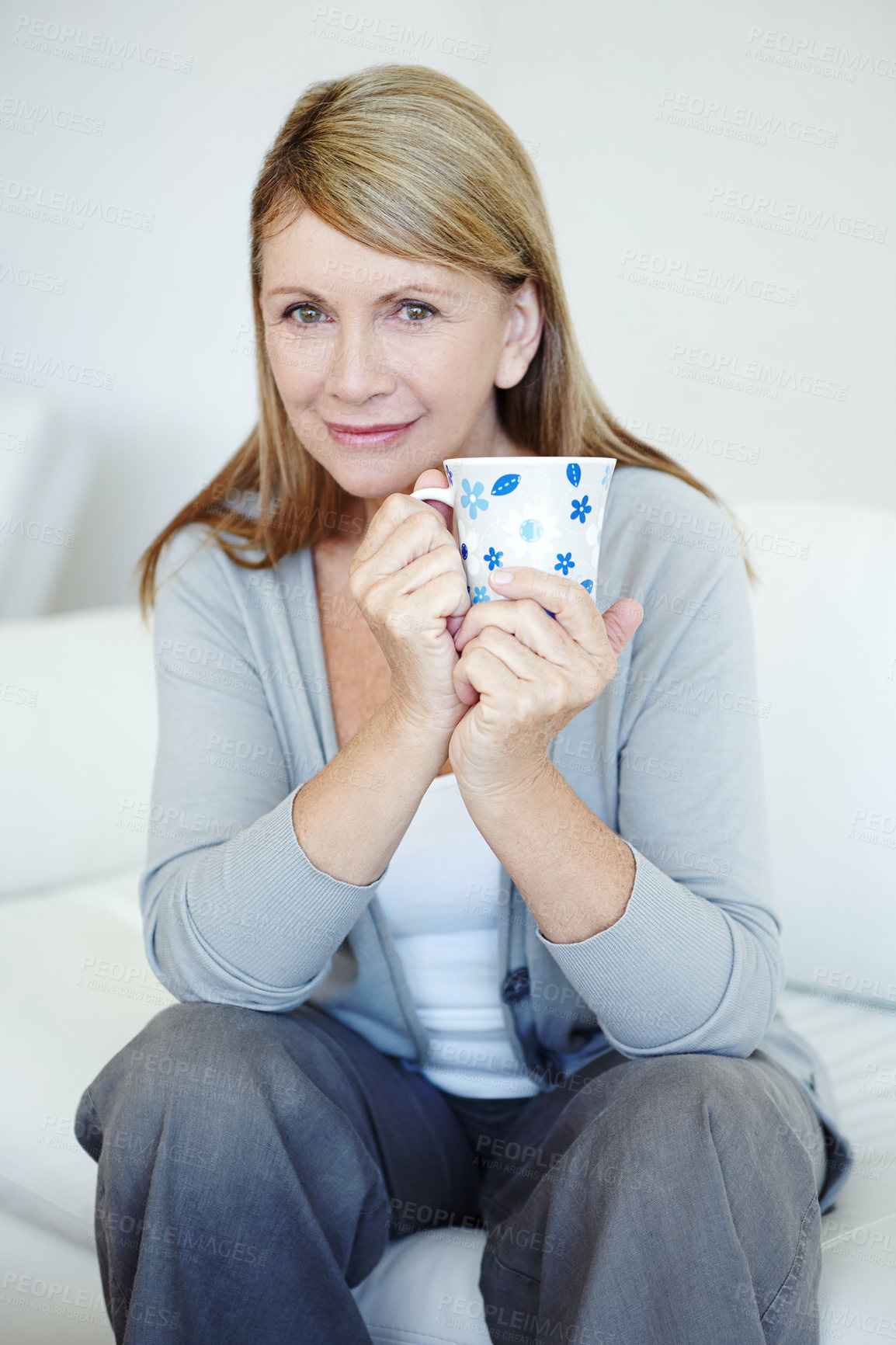 Buy stock photo Portrait, home and senior woman with coffee, relax and happiness with espresso in living room. Face, apartment and mature person with cup, herbal tea and morning for cappuccino, calm and comfortable