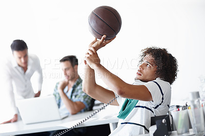 Buy stock photo Young man, telephone and basketball with call for online advice, telemarketing or customer service at office. Male person, agent salesman or playful consultant with ball on phone for deal or sale