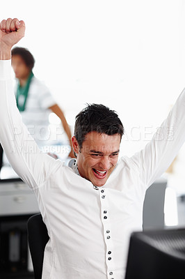 Buy stock photo Excited man, celebration and winning with fist pump for promotion, victory or raise at office. Happy male person or young employee with smile for good news, prize or deal of online offer at workplace