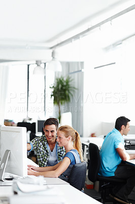 Buy stock photo Man, woman and coworking at computer for design, web development or collaboration in office. Teamwork, support or creative business people with advice, discussion or internship at digital agency