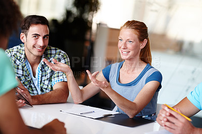 Buy stock photo Young colleagues having a meeting in the office