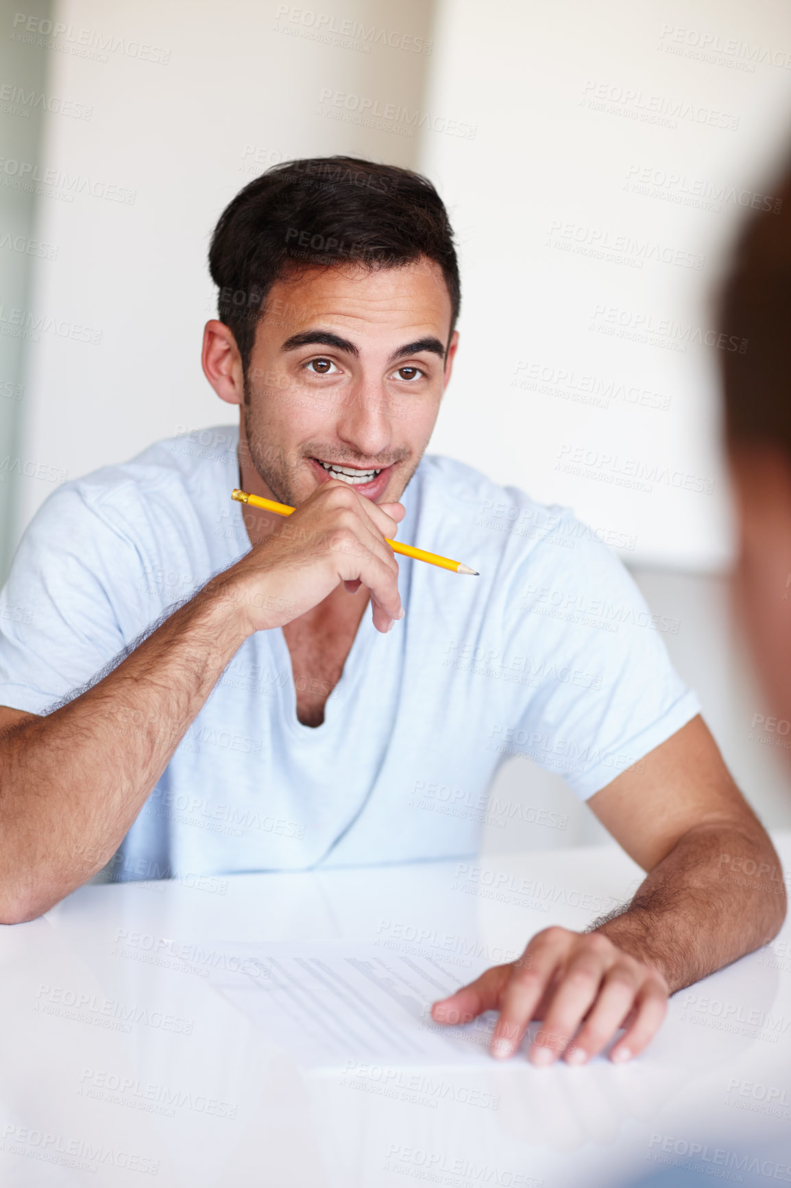 Buy stock photo Young colleagues having a meeting in the office