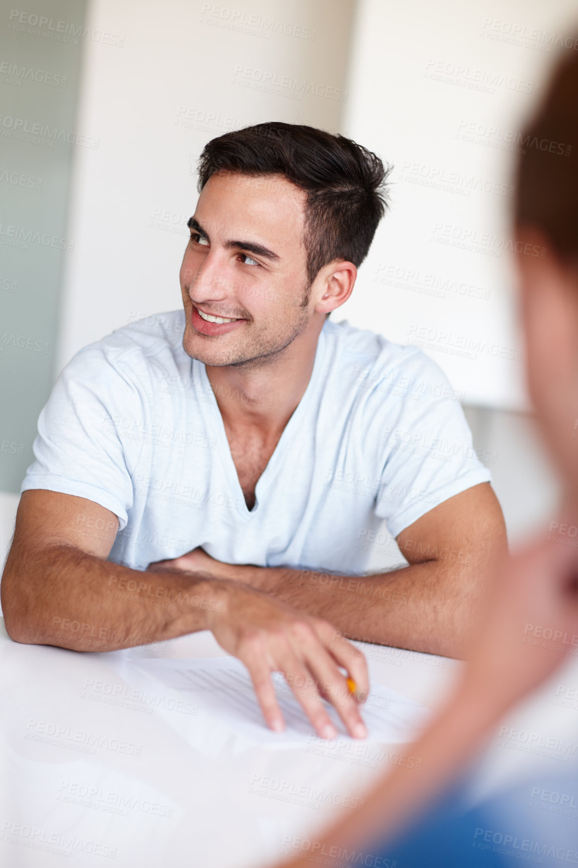 Buy stock photo Meeting, office and man with business people in discussion for planning, teamwork and project review. Design agency, startup and happy worker in boardroom for feedback, collaboration and talking