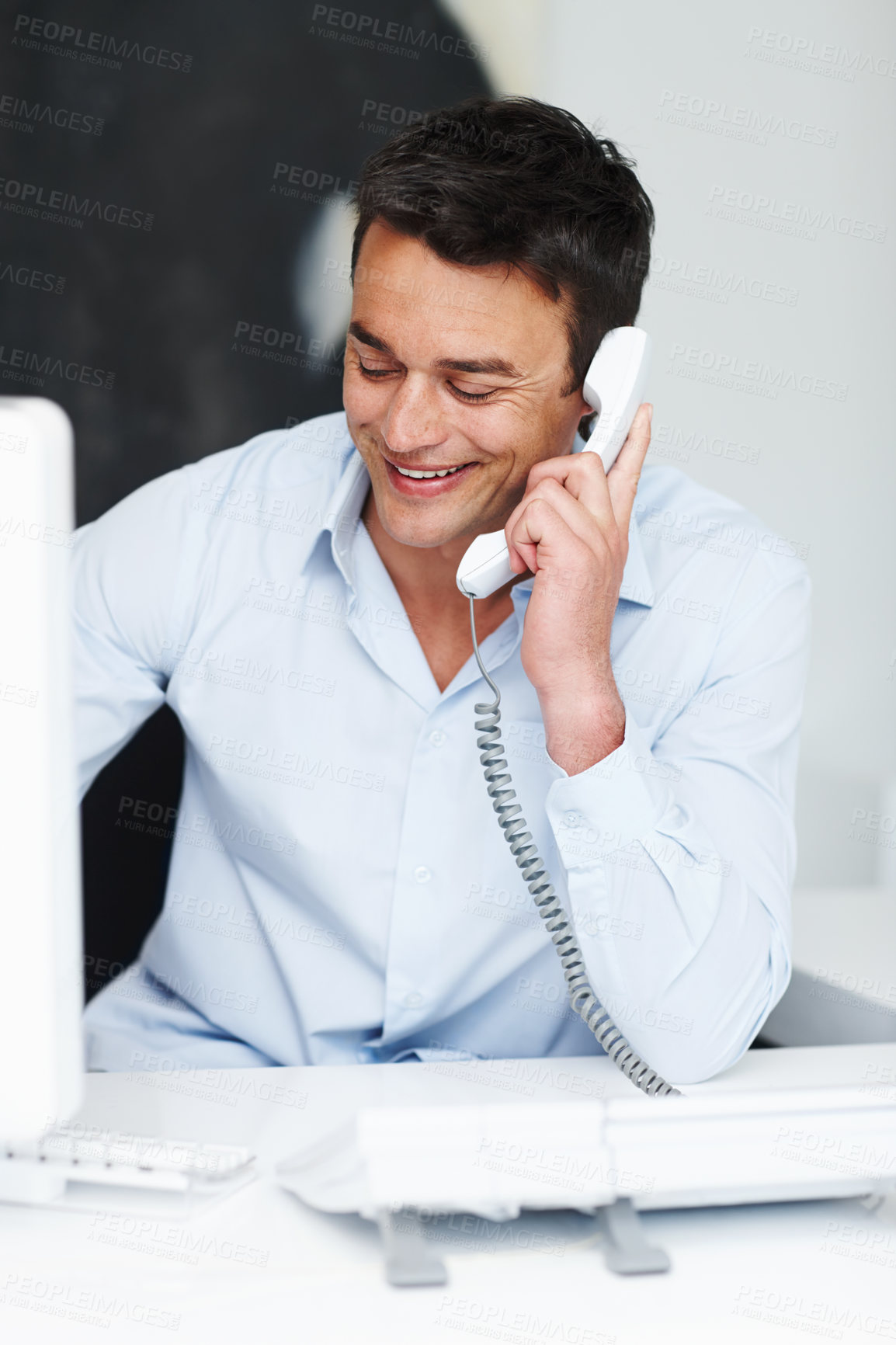 Buy stock photo Business man, landline and phone call in office for conversation, networking and legal advice. Career, male lawyer and telephone with smile for communication, assistance and listening to client