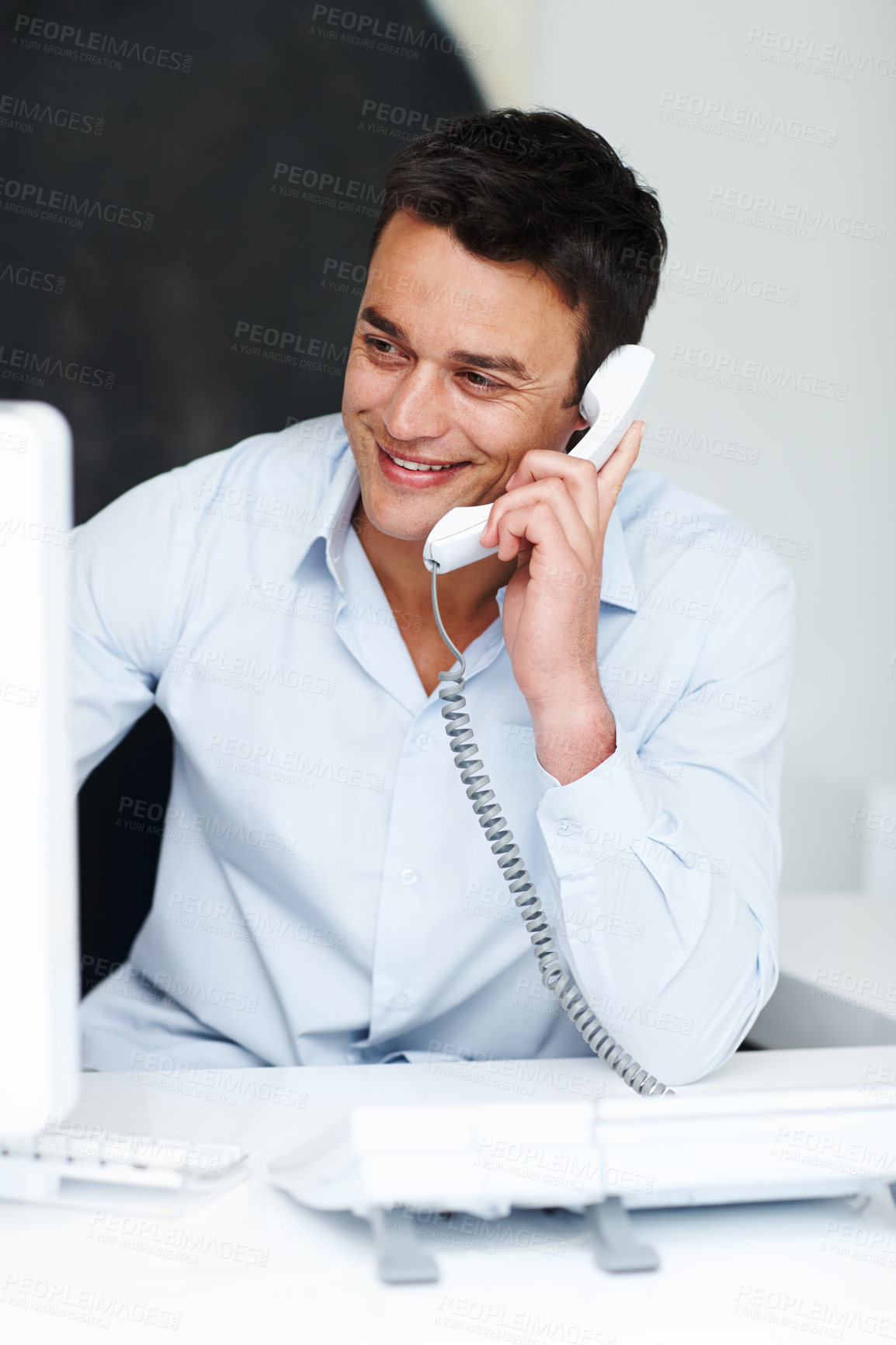 Buy stock photo Businessman, landline and phone call in office for conversation, networking and legal advice. Career, male lawyer and telephone with smile for communication, assistance and listening to client