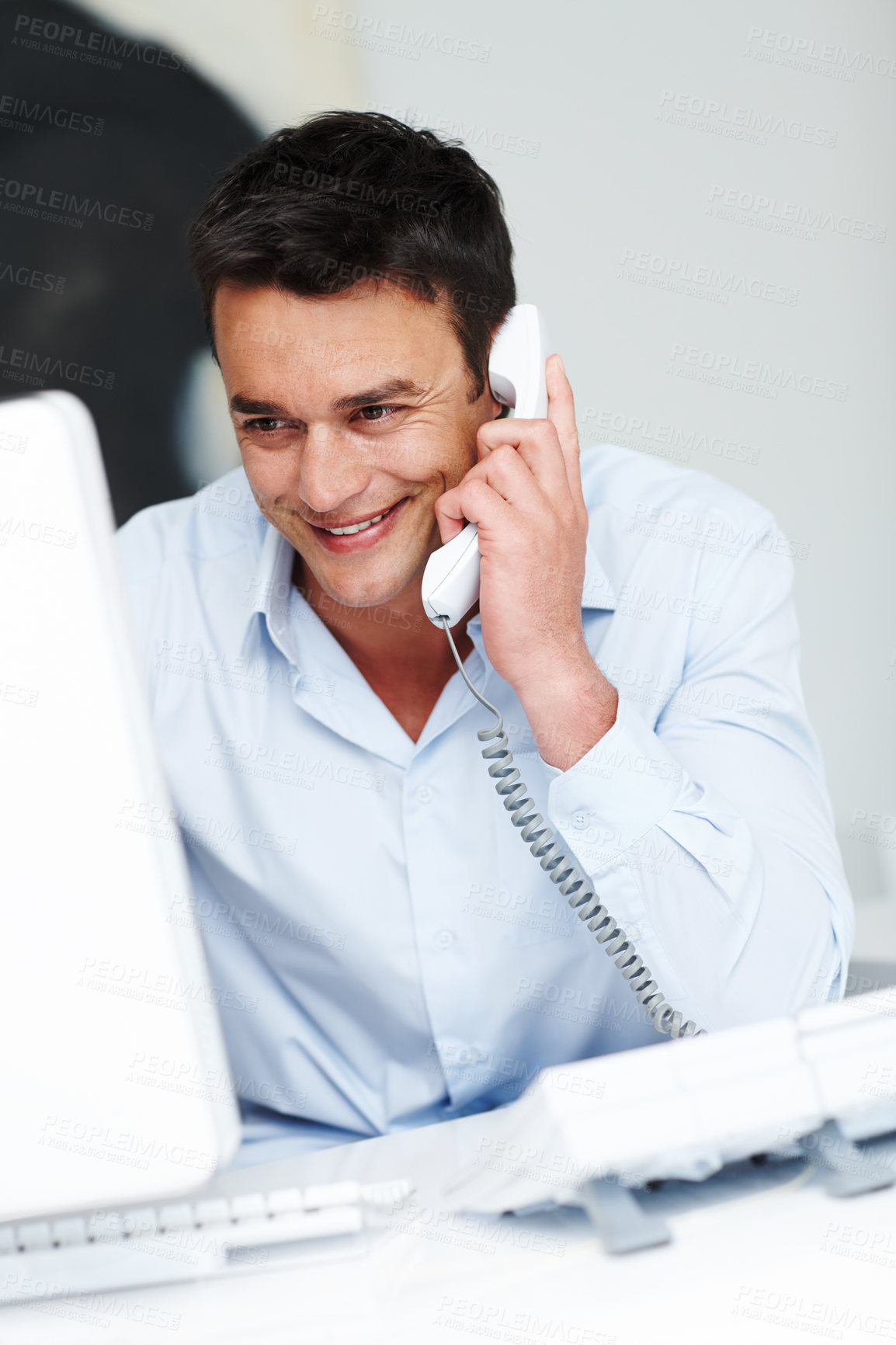 Buy stock photo Businessman, landline and phone call in office for communication, legal advice and search on computer. Career, male lawyer and telephone with smile for conversation, assistance or listening to client