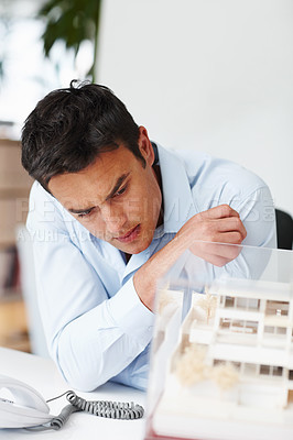Buy stock photo A young male architect working in the office
