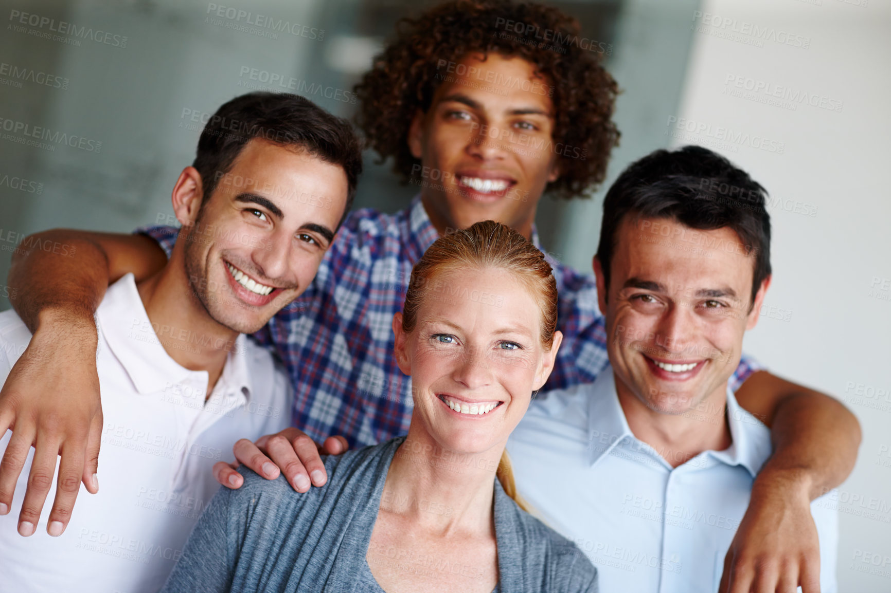 Buy stock photo A group of casual business people standing together and smiling