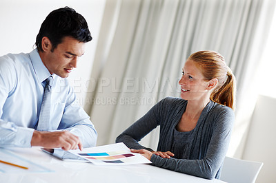 Buy stock photo Two businesspeople having a discussion about a project together