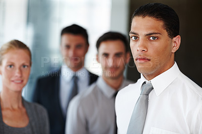 Buy stock photo Lawyers, office and portrait of man with business people for teamwork, collaboration and legal career. Corporate attorney, law firm and workers with confidence, serious and meeting for company pride