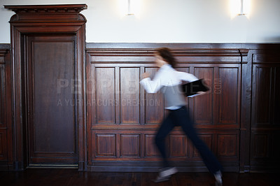 Buy stock photo Business, person and running in building with motion blur, urgency or legal document for case. Lawyer, fast or rush to courtroom with evidence, information or late for hearing with folder for justice