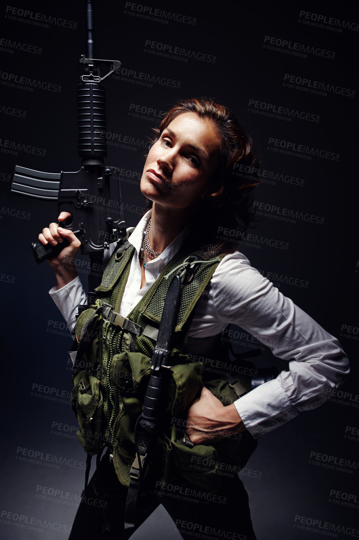 Buy stock photo Woman, warrior and gun in studio with portrait face for action, fight and danger safety. Female model, soldier or agent in bulletproof vest, body armor or camouflage with weapon on dark background