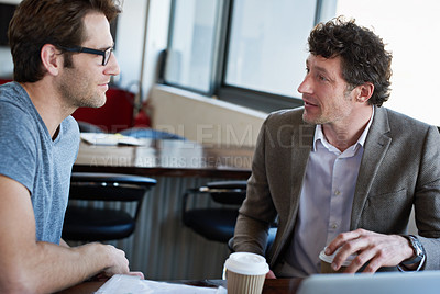 Buy stock photo Colleague, talking and office with coffee for company career, professional planning and innovative business strategy. Young man with mature person or analyst on break for job feedback for profession