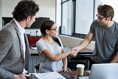 Buy stock photo Meeting, handshake and office for new colleagues at work with greeting, gesture and teamwork. Man, woman and hand for welcome with laptop at desk for partnership in workplace for startup with people