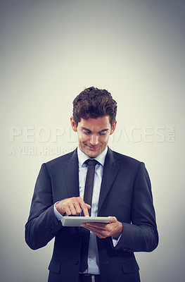 Buy stock photo Tablet, research and business man scroll in studio isolated on gray background mockup space for communication. Digital technology, trader and happy professional, networking or reading email on app