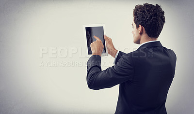 Buy stock photo Tablet, research and business man in studio isolated on gray background mockup space for communication. Digital technology, consultant and professional scroll on screen, back or reading email on app