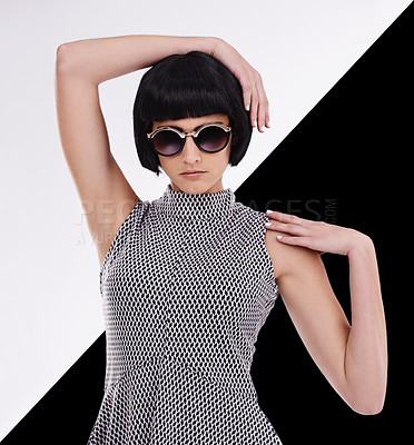 Buy stock photo Studio shot of a retro-stylish young woman against a black and white background