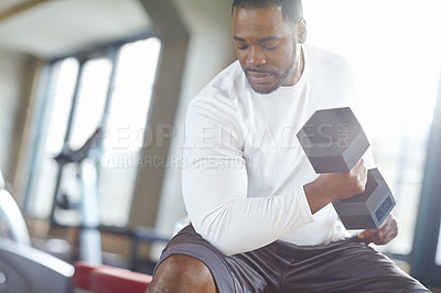Buy stock photo Black man, weight lifting and exercise in gym for fitness with dumbbell, workout challenge and strong muscle. Bodybuilder, pro athlete and strength training for routine and concentration on mockup