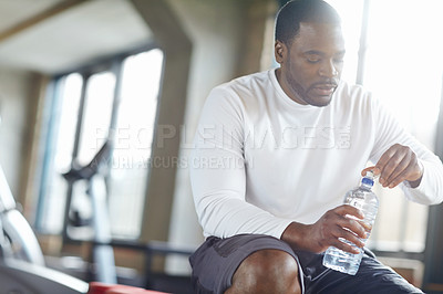 Buy stock photo Gym, fitness and black man with water for training recovery, break or body hydration after exercise. Sports, liquid and African athlete with mineral drink for health, wellness and workout balance