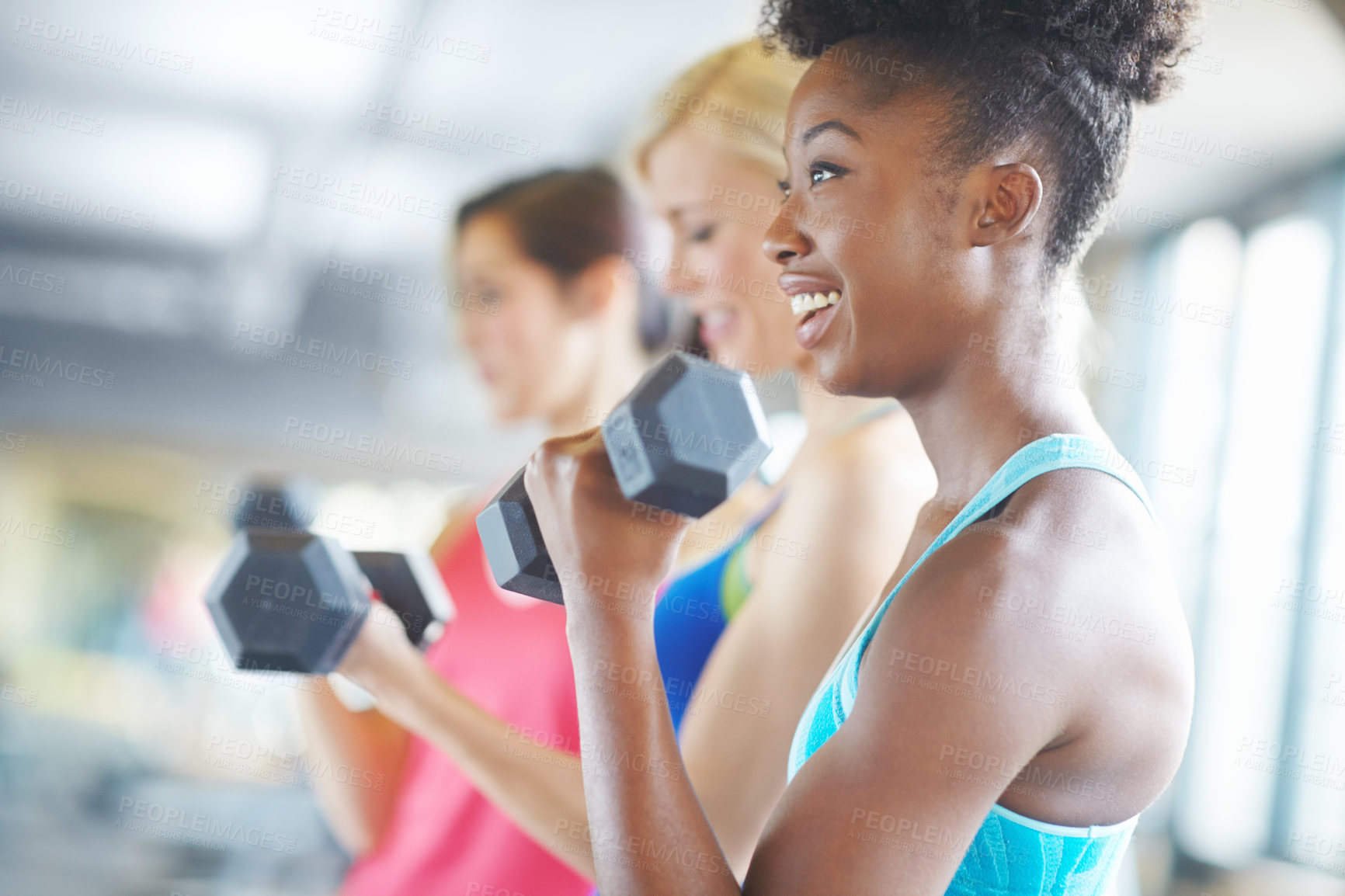 Buy stock photo Woman, dumbbell and happy for workout in gym for fitness, class and muscle growth. Female person, weight and smile for exercise in center for training, sport and strength development or health