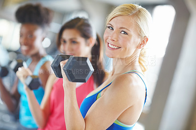 Buy stock photo Happy woman, face smile and gym workout with dumbbell for muscle, strong body and training class. Female athlete, exercise and weightlifting in wellness club with fitness, healthy friends and energy