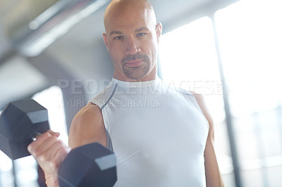 Buy stock photo Portrait, athlete or serious man with dumbbell in workout, fitness training or exercise for grip power. Strong, bodybuilding or person with weights for pump, sports challenge or energy in gym