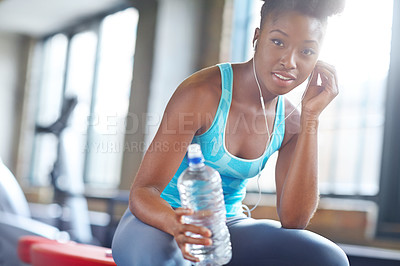 Buy stock photo Portrait, health and black woman with water, listening music and fitness with progress and peace. Face, African person and athlete with hydration, training and song for exercise and relax with break