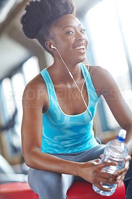 Buy stock photo Black woman, water bottle and portrait in gym for workout, fitness and exercise for wellness. Training, energy and female person listening to music for happiness, pilates and earphones in sport club