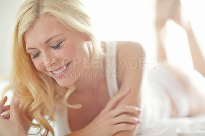 Buy stock photo Relax, carefree and woman on bed with smile, morning health or wellness on weekend in home. Wake up, underwear and face of happy girl in bedroom for rest, comfort or fresh start to day in Sweden