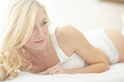 Buy stock photo Relax, calm and woman on bed with morning health, wellness and lingerie on weekend in home. Wake up, underwear and girl in bedroom for comfort, carefree or fresh start to day in apartment in Germany