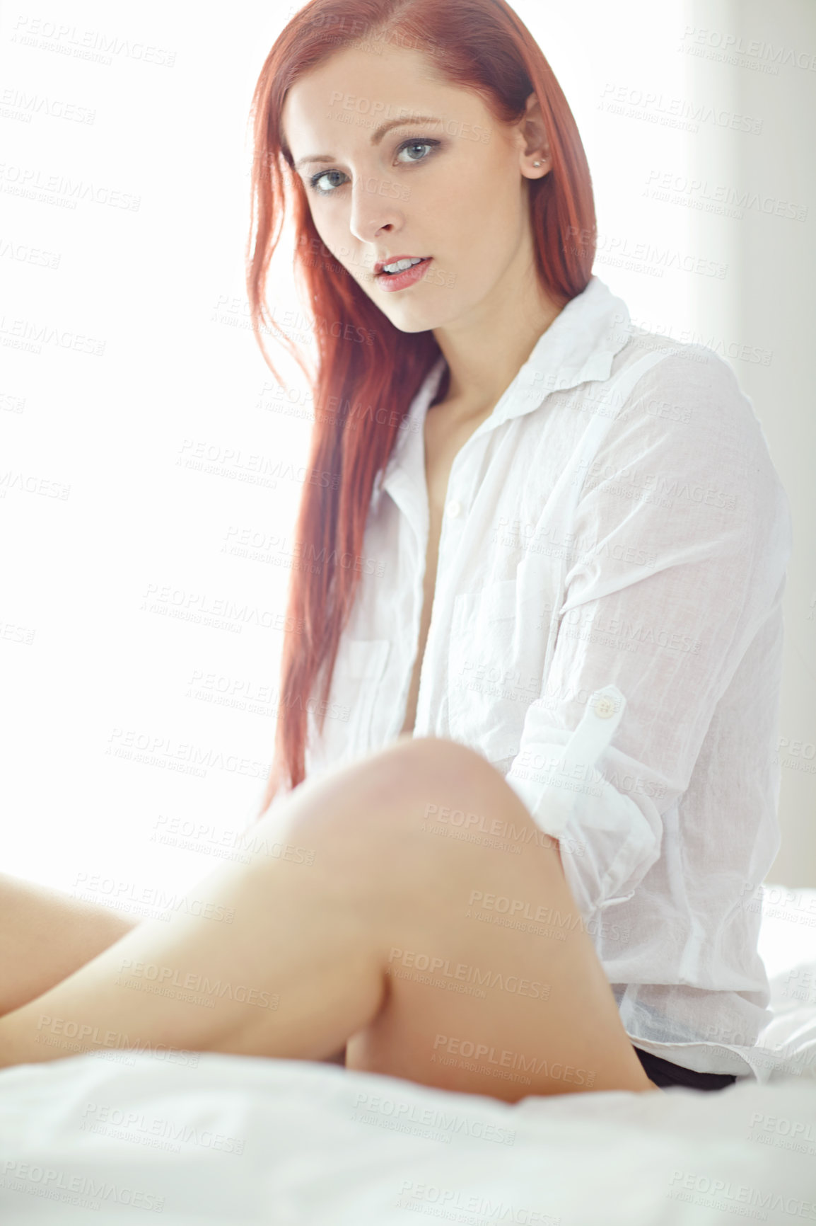 Buy stock photo Sexy, shirt and portrait of woman on bed for sensual style, confidence and temptation at home. Serious, relax and ginger person with pride in morning for alluring outfit, luxury fashion and clothes