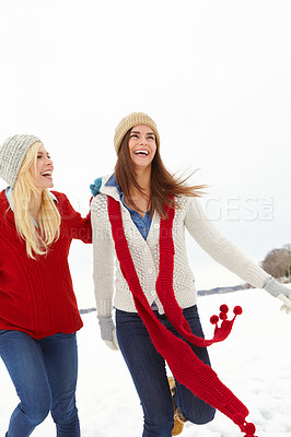 Buy stock photo Women, laugh and snow in winter for vacation is Alaska for Christmas, festive and travel for bonding. Female people, play and friendship with trip, happiness and love for holiday, break or retreat