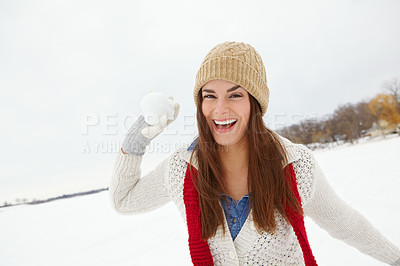 Buy stock photo Portrait, snowball and happy woman in winter to play, beanie or jersey in Sweden on holiday vacation. Female person, throw or face of girl on outdoor trip for travel, adventure or wellness in nature