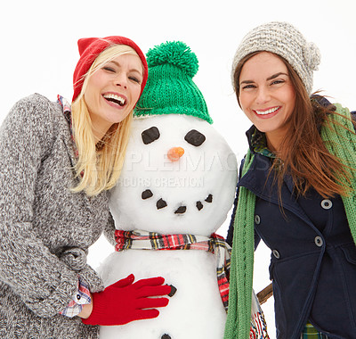 Buy stock photo Christmas, women and snowman with snow and holiday celebration, xmas portrait and happiness in winter. Friends, happy and nature, celebrate together outdoor, tradition and festive on white background